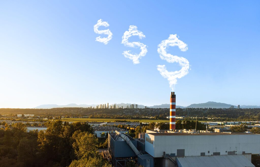 Industrial emissions forming dollar sign highlighting carbon pricing costs under CBAM and EU ETS regulations